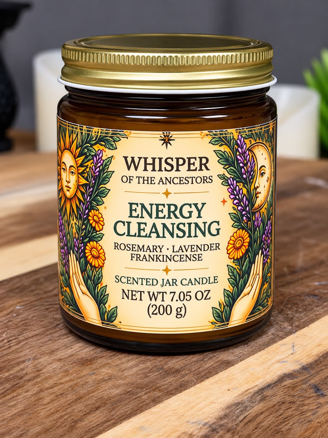 Energy Cleansing scented jar candle in an amber glass jar with a gold lid and illustrated label, on a wooden table